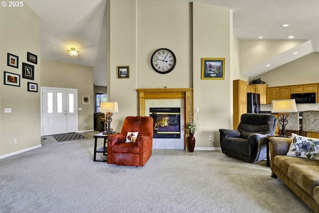1922 Kapela Ct, Sutherlin, OR 97479 - living area featuring high vaulted ceiling, light carpet, baseboards, a tile fireplace, and recessed lighting
