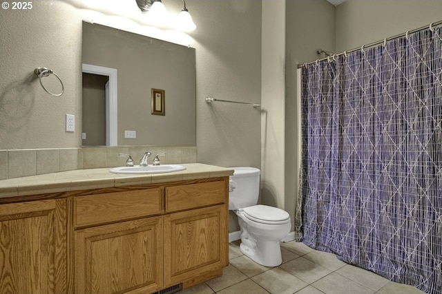 1922 Kapela Ct, Sutherlin, OR 97479 - full bathroom with tile patterned flooring, toilet, vanity, a shower with shower curtain, and a textured wall