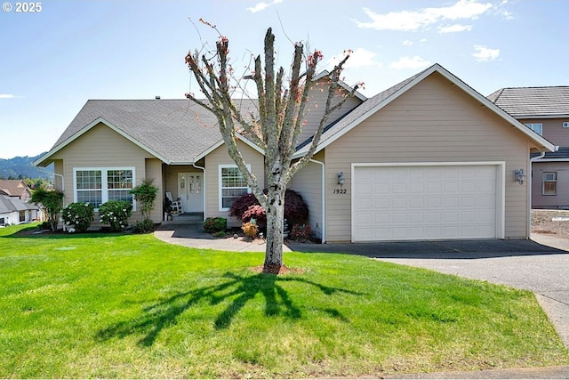 1922 Kapela Ct, Sutherlin, OR 97479 - view of front of house featuring driveway, a garage, and a front lawn