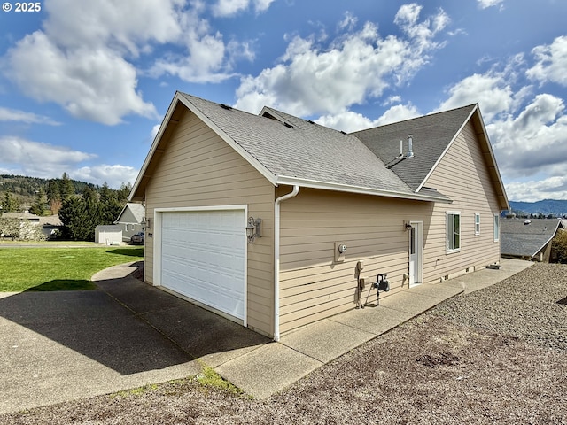 1922 Kapela Ct, Sutherlin, OR 97479 - view of side of property with roof with shingles, asphalt driveway, a lawn, and an attached garage