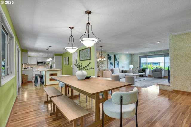 4729 SE Concord Rd, Milwaukie, OR 97267 - dining area featuring light wood finished floors, a chandelier, baseboards, and recessed lighting