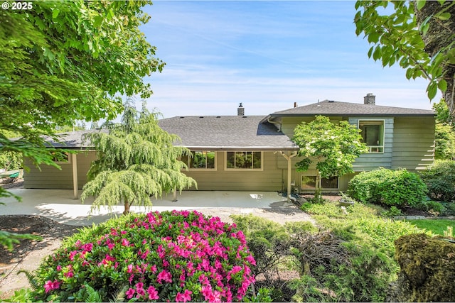 4729 SE Concord Rd, Milwaukie, OR 97267 - view of front of house with a patio area, a chimney, and a shingled roof