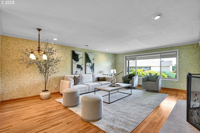 4729 SE Concord Rd, Milwaukie, OR 97267 - living area with wallpapered walls, hardwood / wood-style floors, a chandelier, baseboards, and ornamental molding