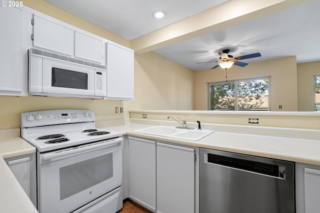 7145 SW Sagert St Unit 103, Tualatin, OR 97062 - kitchen featuring white appliances, plenty of natural light, light countertops, and recessed lighting