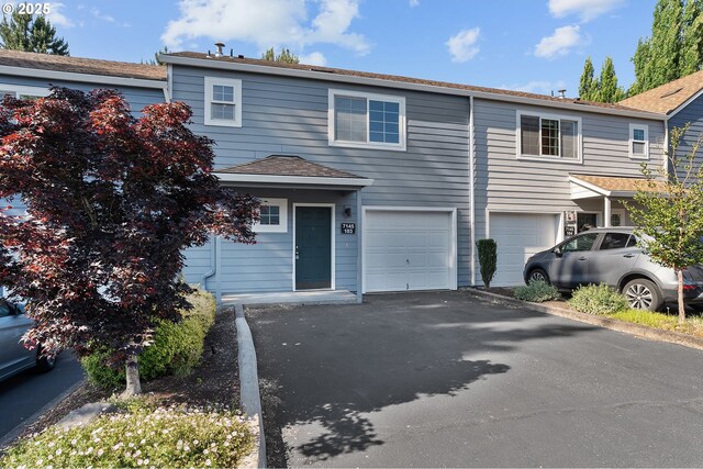 7145 SW Sagert St Unit 103, Tualatin, OR 97062 - townhome / multi-family property featuring an attached garage and driveway