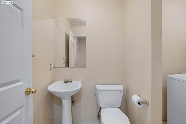 7145 SW Sagert St Unit 103, Tualatin, OR 97062 - half bath with washer / clothes dryer and toilet
