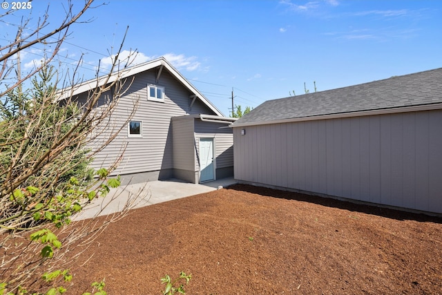 back of house with a patio