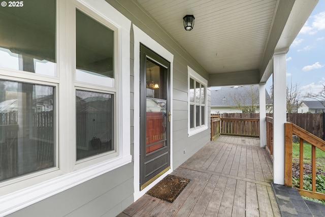 wooden deck featuring covered porch