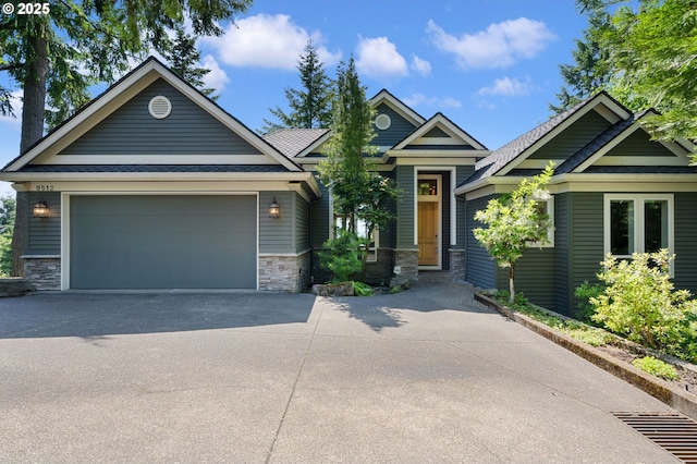 9512 NW Thompson Rd, Portland, OR 97229 - craftsman inspired home featuring concrete driveway, stone siding, and an attached garage