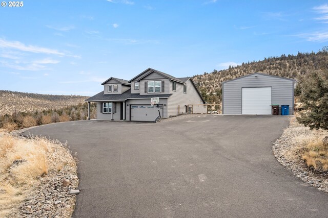 7220 SE Night Hawk Ct, Prineville, OR 97754 - view of front of property with a detached garage and an outdoor structure