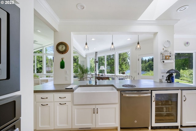 kitchen with pendant lighting, dishwasher, white cabinetry, and beverage cooler