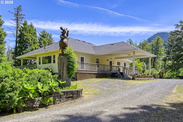 view of side of home with covered porch