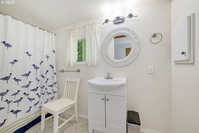 bathroom featuring vanity and a shower with curtain