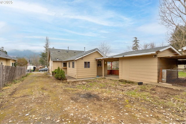 rear view of house with a carport