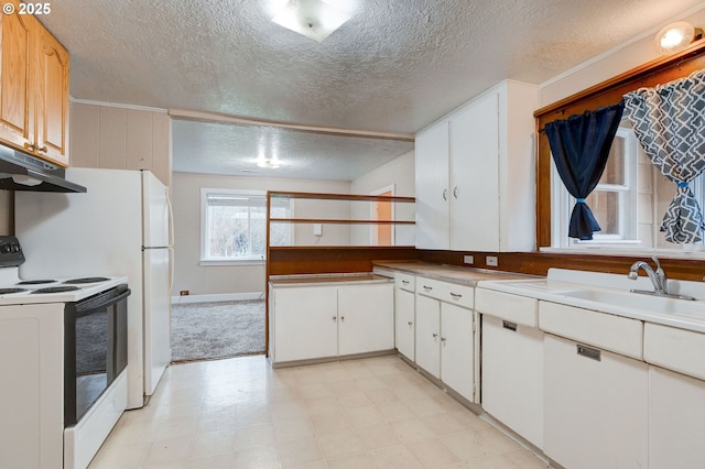 kitchen featuring electric stove, sink, white cabinetry, and a textured ceiling