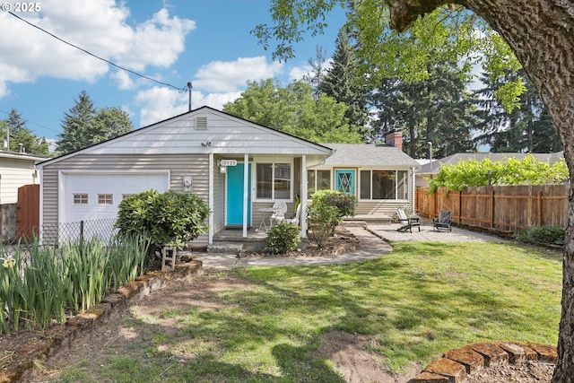 10925 NE Skidmore St, Portland, OR 97220 - view of front of home with a chimney, a garage, a sunroom, and a patio