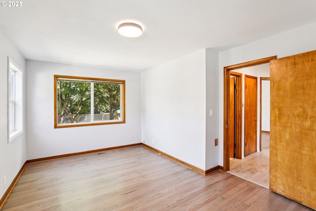 10925 NE Skidmore St, Portland, OR 97220 - empty room featuring light wood finished floors and baseboards