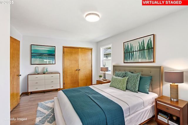 10925 NE Skidmore St, Portland, OR 97220 - bedroom featuring a closet and wood finished floors