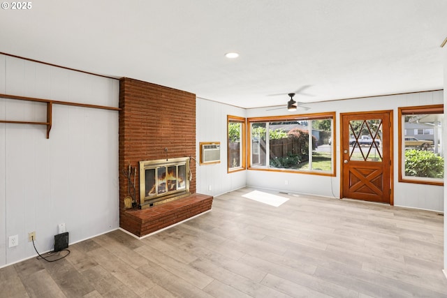 10925 NE Skidmore St, Portland, OR 97220 - unfurnished living room with a ceiling fan, wood finished floors, a brick fireplace, plenty of natural light, and recessed lighting