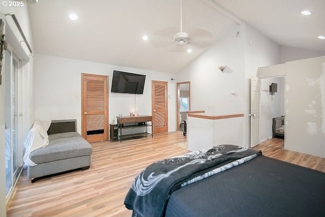 bedroom featuring ceiling fan, high vaulted ceiling, and light wood-type flooring