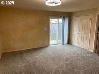 unfurnished bedroom with carpet