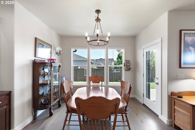1705 Trevino Rd, Creswell, OR 97426 - dining room featuring light wood-style floors, a chandelier, and plenty of natural light