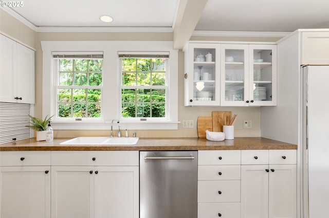 kitchen featuring dishwasher, sink, crown molding, and white cabinetry