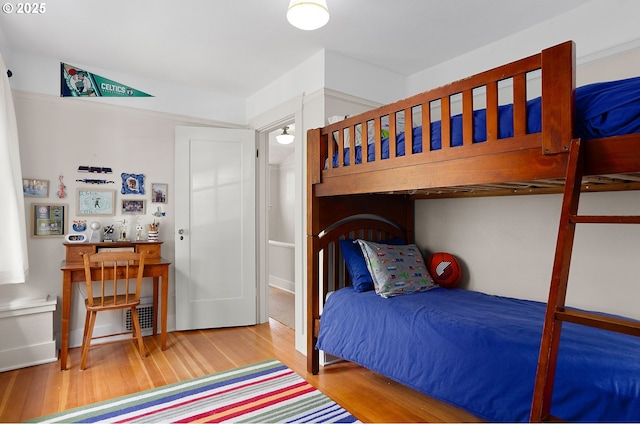 bedroom with hardwood / wood-style flooring