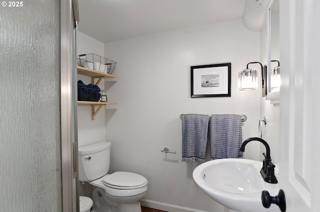 bathroom featuring sink and toilet