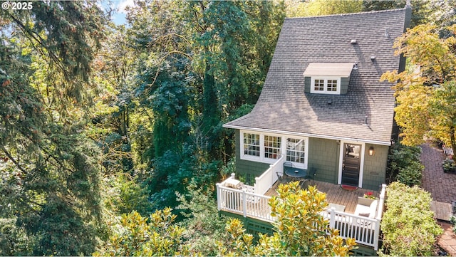 back of property with a wooden deck