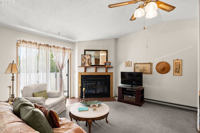 11044 SW Greenburg Rd Unit 321, Portland, OR 97223 - living room featuring a fireplace with flush hearth, a ceiling fan, a baseboard heating unit, a textured ceiling, and carpet