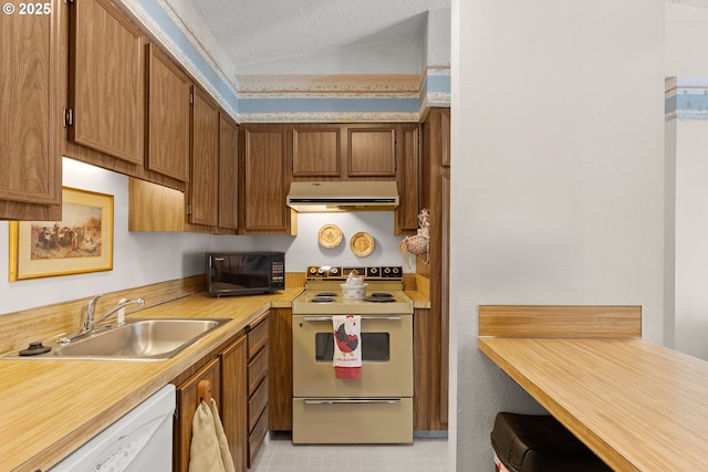 11044 SW Greenburg Rd Unit 321, Portland, OR 97223 - kitchen featuring exhaust hood, white appliances, a sink, light countertops, and a textured ceiling