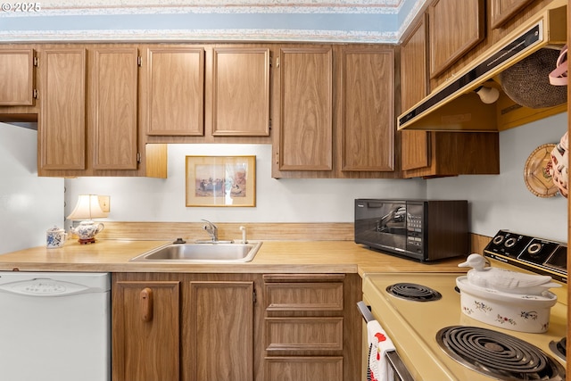 11044 SW Greenburg Rd Unit 321, Portland, OR 97223 - kitchen featuring white appliances, under cabinet range hood, a sink, and light countertops