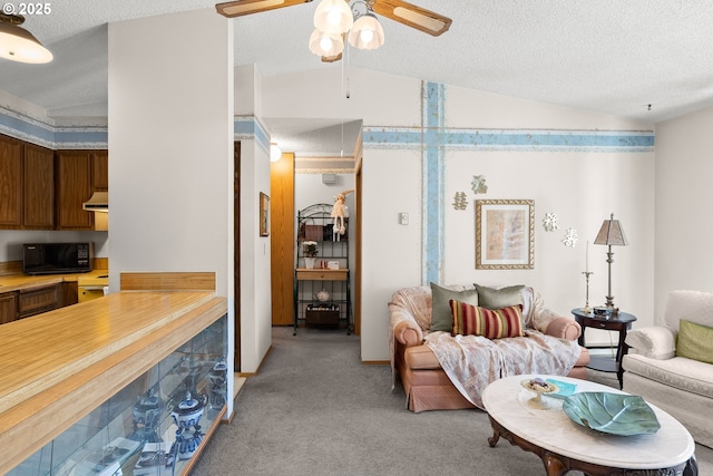 11044 SW Greenburg Rd Unit 321, Portland, OR 97223 - living area featuring vaulted ceiling, light carpet, ceiling fan, a textured ceiling, and attic access