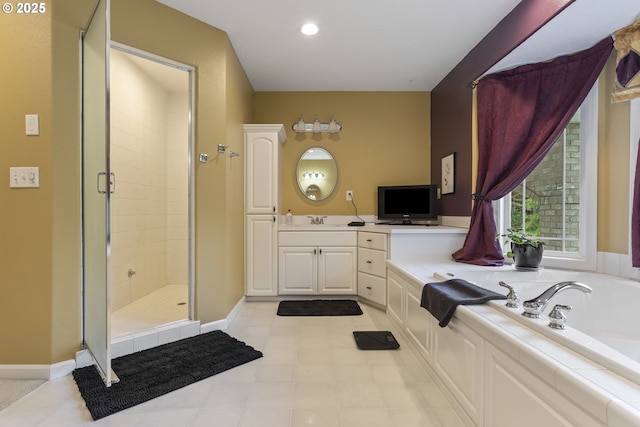 full bath with a stall shower, a bath, baseboards, vanity, and recessed lighting