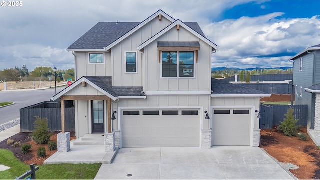 4300 N 12th Way, Ridgefield, WA 98642 - craftsman-style house featuring board and batten siding, fence, driveway, and stone siding