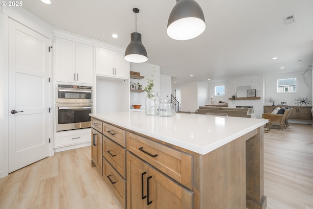 4300 N 12th Way, Ridgefield, WA 98642 - kitchen with a center island, decorative backsplash, white cabinetry, and stainless steel appliances