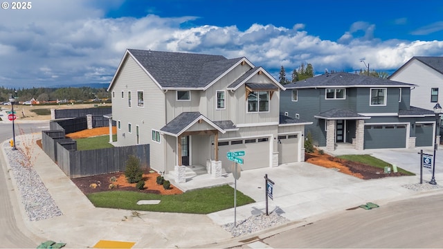 4300 N 12th Way, Ridgefield, WA 98642 - view of front of home featuring roof with shingles, fence, an attached garage, board and batten siding, and driveway