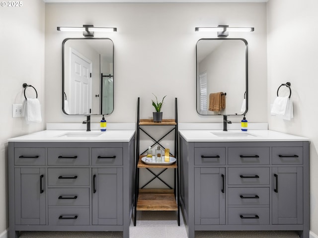 full bath featuring two vanities and a sink