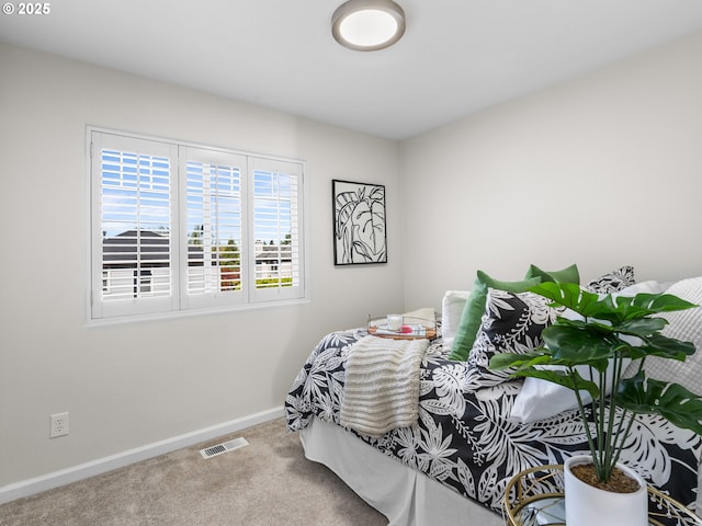 bedroom with visible vents, baseboards, and carpet floors