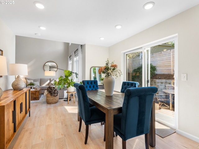 dining area featuring recessed lighting, baseboards, and light wood finished floors