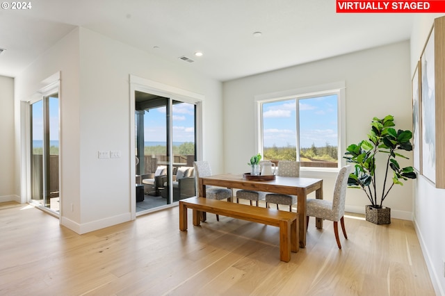 dining space featuring light hardwood / wood-style flooring