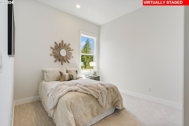 bedroom with light hardwood / wood-style floors