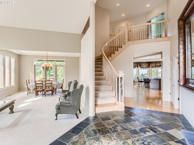 9112 NW Wiley Ln, Portland, OR 97229 - foyer entrance featuring stairs, healthy amount of natural light, baseboards, recessed lighting, and a towering ceiling