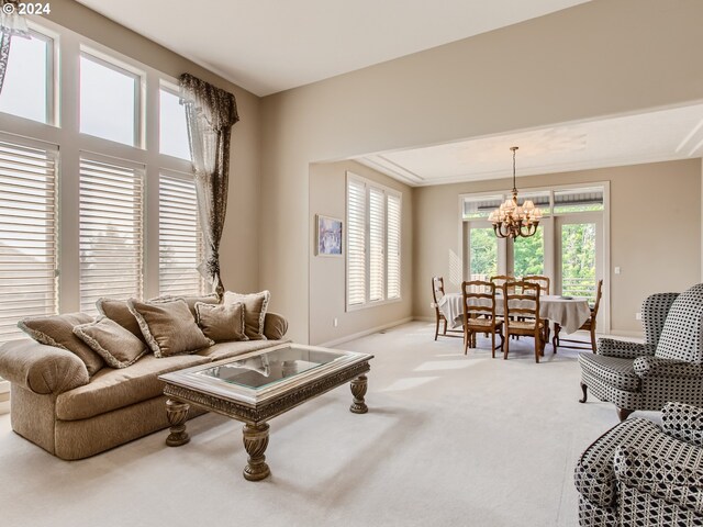 9112 NW Wiley Ln, Portland, OR 97229 - living area featuring a chandelier, light carpet, and baseboards