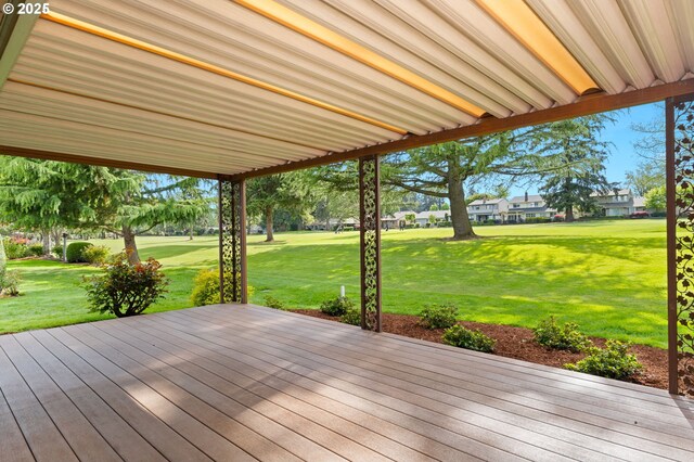 wooden deck with a lawn