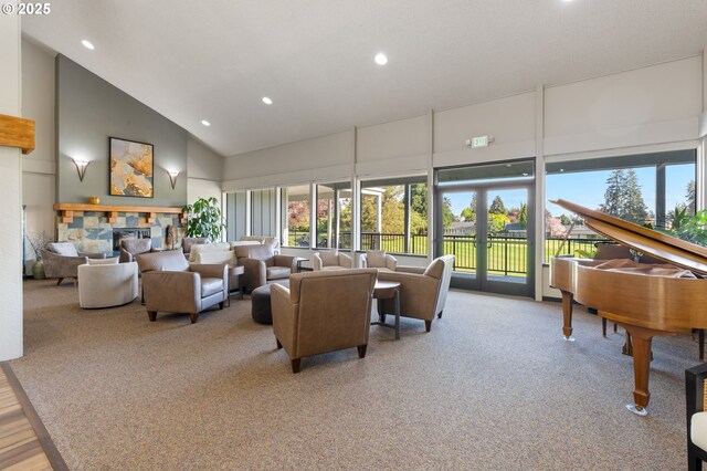 carpeted living area featuring recessed lighting, a wealth of natural light, and high vaulted ceiling