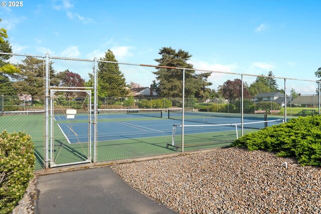 view of sport court with fence