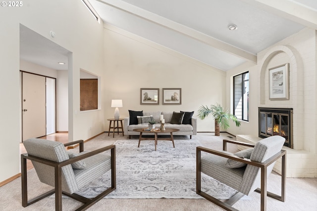 living room with baseboards, vaulted ceiling with beams, light carpet, and a brick fireplace