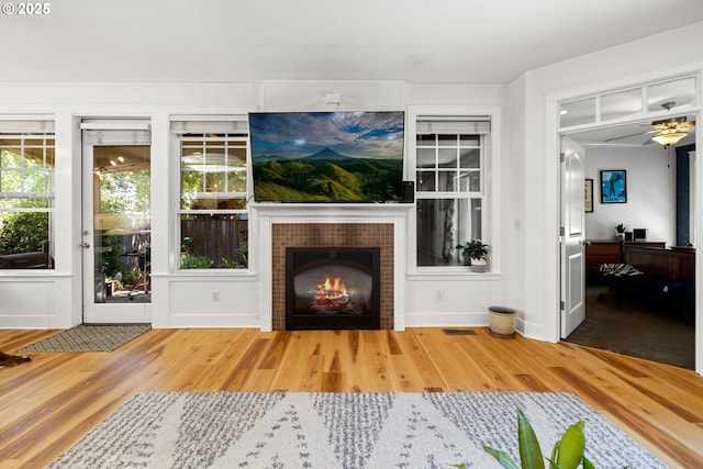 9628 N Exeter Ave, Portland, OR 97203 - living area with wood finished floors and a tile fireplace